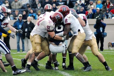 Cover image for Football Pummels Yale, Takes Ivy Title in The Game