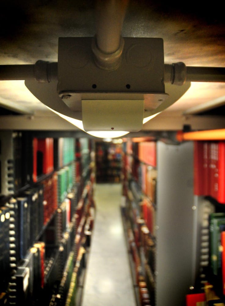 Motion sensors, similar to this one installed in A level of Widener Library, have been credited with conserving thousands in both watts and dollars.