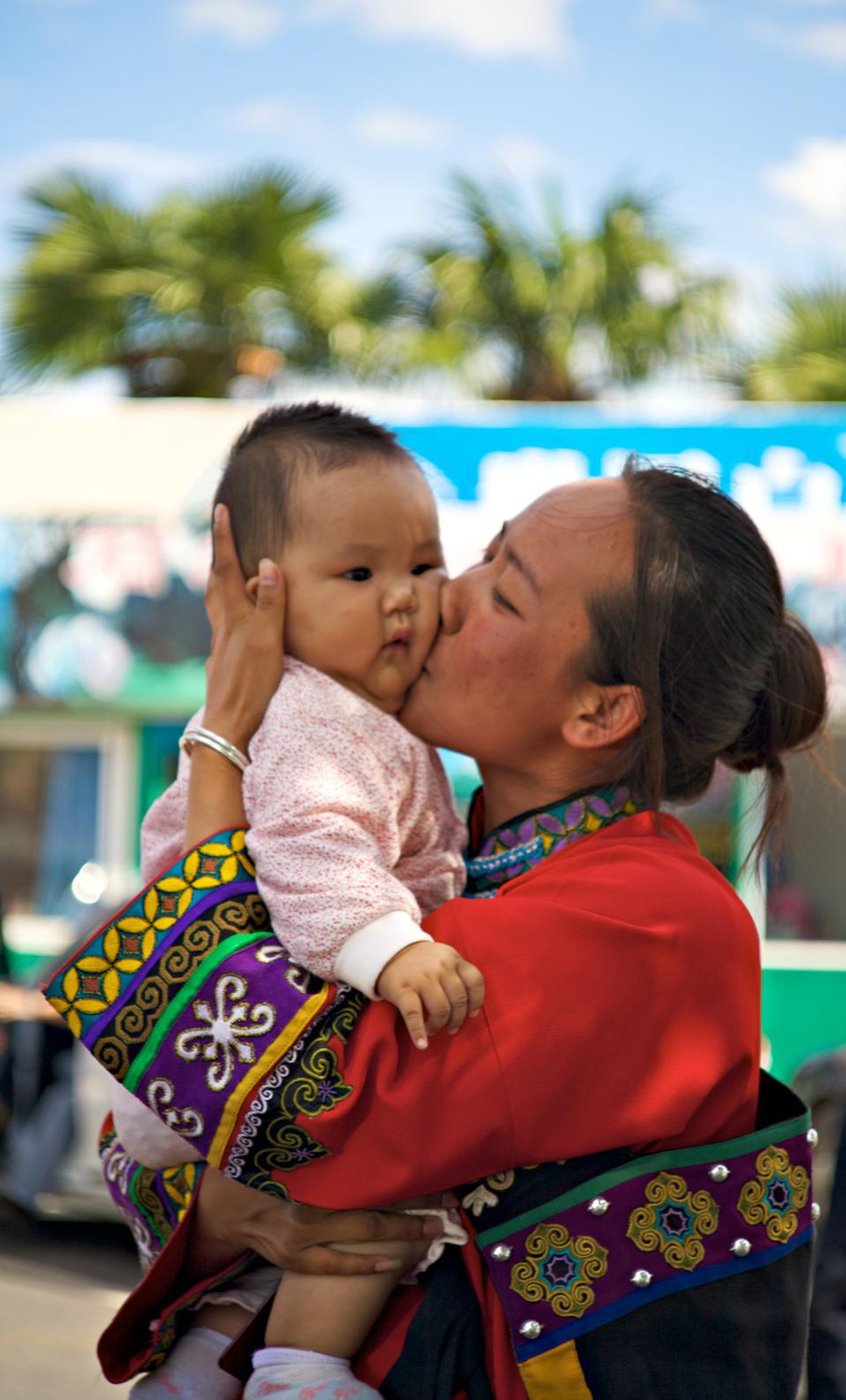 China is home to more than 40 ethnic minorities, and Yunnan Province alone has 25 of them. This mother and child are of the Yi minority, which can be distinguished from the others by its elaborate style of dress.

