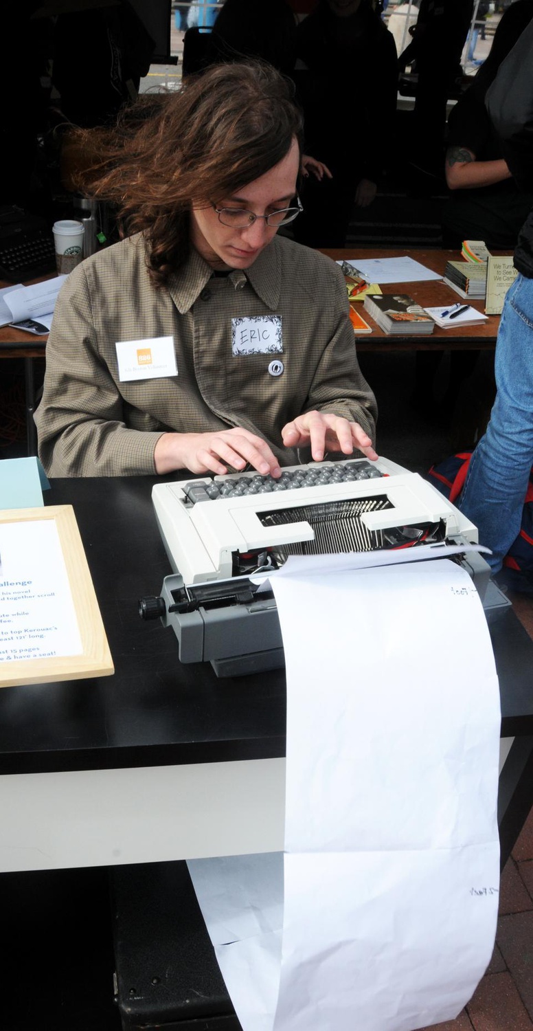 Eric Notaro participates in the Jack Kerouac Challenge, which entailed topping Kerouac’s 120 foot scroll by typing a story at least 121 feet long in a single day; a feat that requires typing at least 15 pages an hour. Volunteers came in and traded off all day in efforts to top Kerouac’s accomplishment.