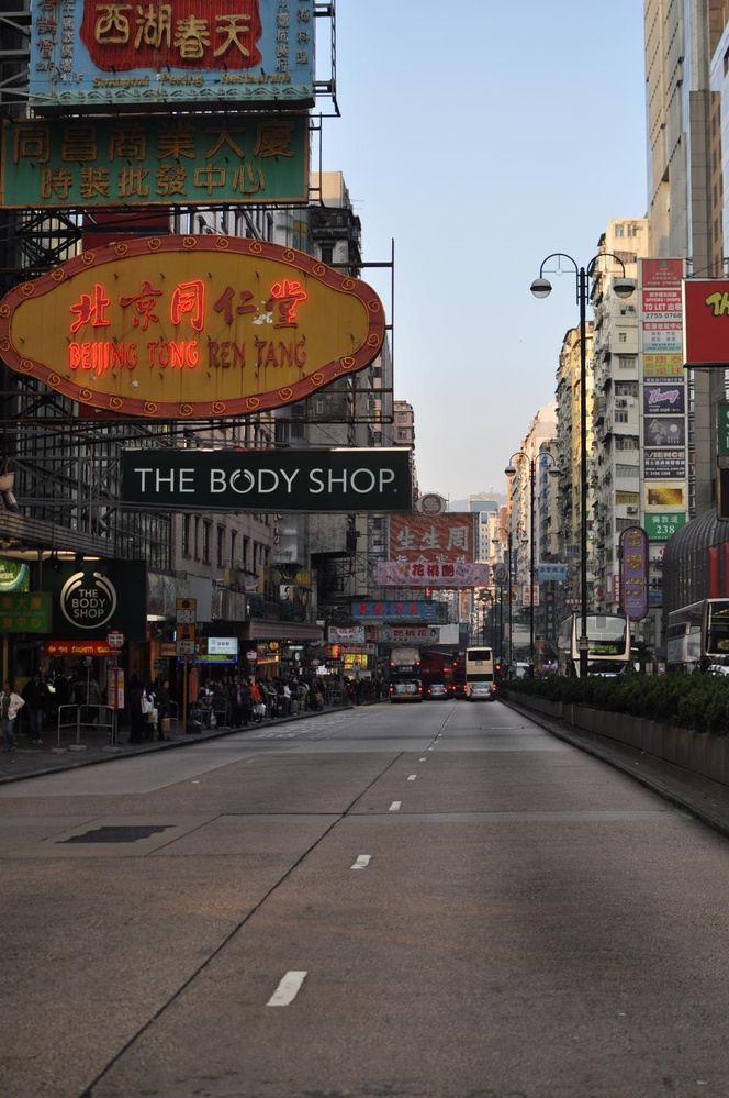 The signs of local and multi-national businesses extend into the middle of the road in Jordan, Hong Kong. 
