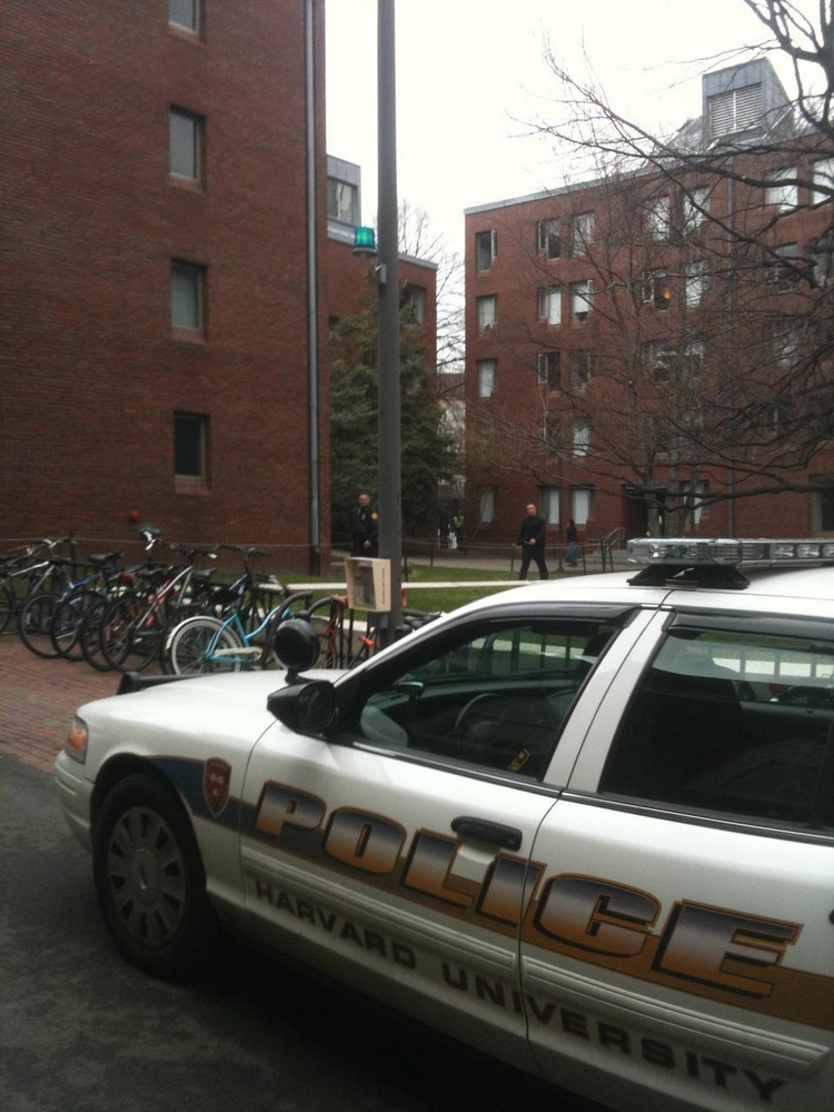 Police converged on Canaday Hall after a foot chase through Harvard Yard which resulted in the apprehension of two men suspected of stealing two cellphones from the T-Mobile store in Harvard Square around noon yesterday.