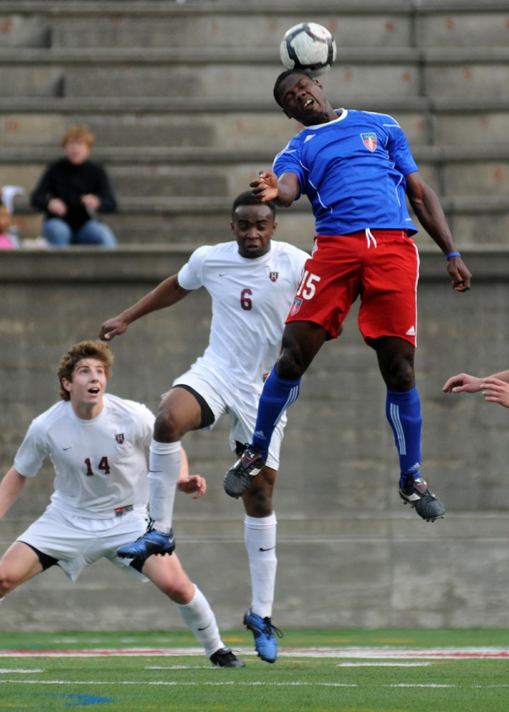 A member of the Haitian national soccer team heads a ball during a charity exihibition game against Harvard men’s soccer. 

