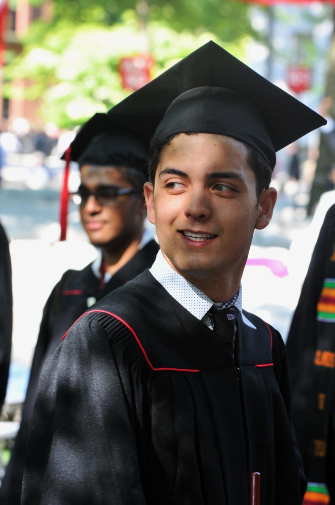 Graduating senior and 2nd Class Marshal Lange P. Luntao prepares to be commenced on the sunny Thursday morning in Tercentary Theatre at Harvard University's 361st Commencement.