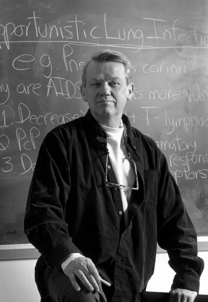 Professor Joseph D. Brain stands before a chalkboard in a photo taken between 15 and 20 years ago, by his estimate. Brain will teach his course "The Human Organism" for the final time this spring.