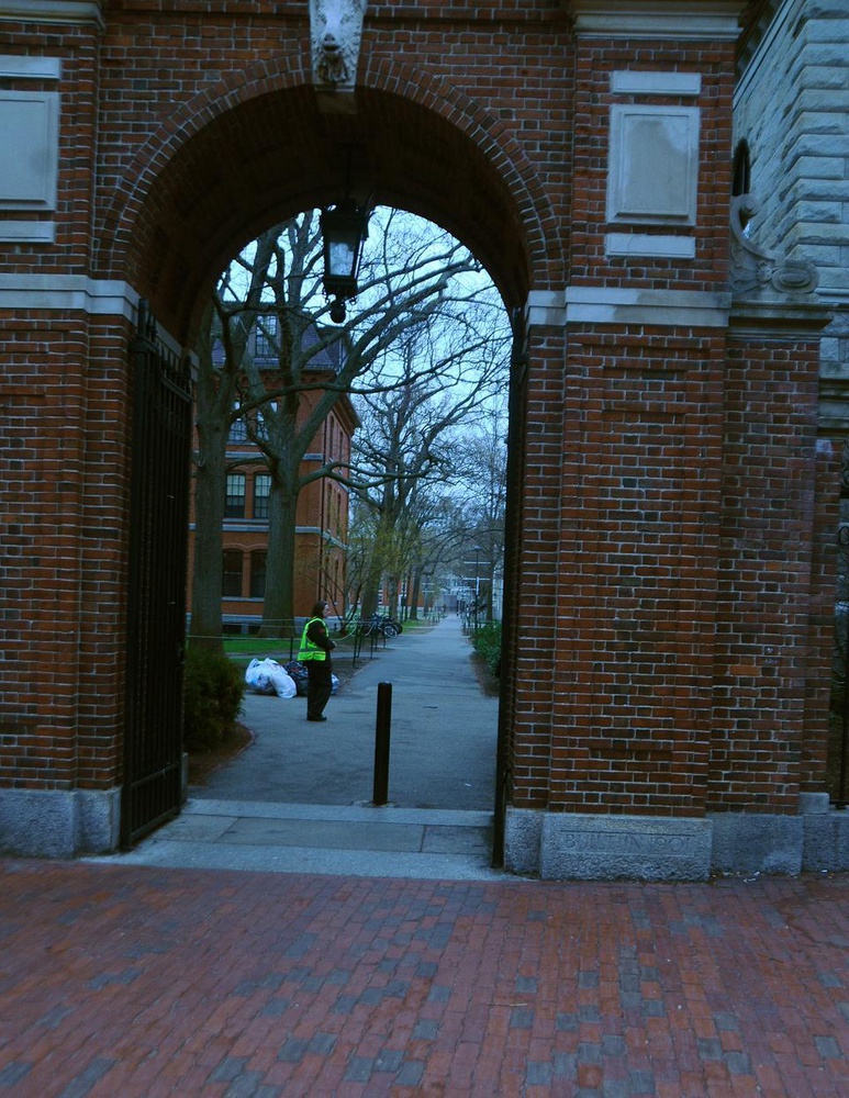 A security officer stands by an entrance to Harvard Yard. In an email to students, Dean of the College Evelynn M. Hammonds promised a "heightened security presence on campus."