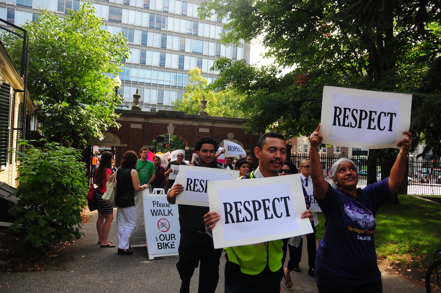 Protesters begin their march through Harvard Yard at a rally on Wednesday afternoon. The rally was held in protest of Harvard Medical School's decision to cut 31 custodial contract jobs, a decision that was made in an effort to reduce the School's operating deficit.