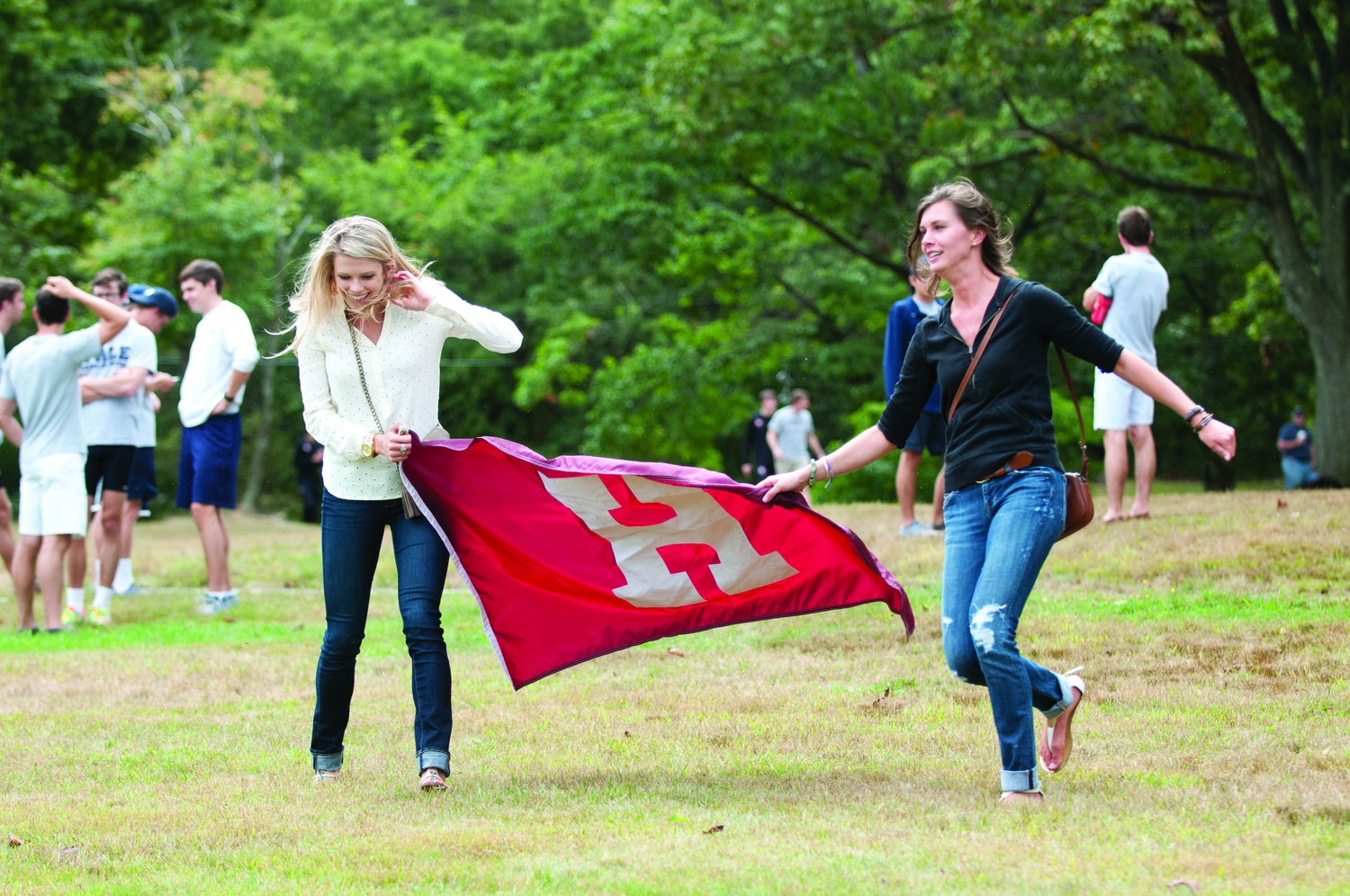 Two fans of the Crimson’s cross country team revel in Harvard’s victorious outing this weekend.  The squad opened up the season with impressive wins over Yale in Boston’s Franklin Park.