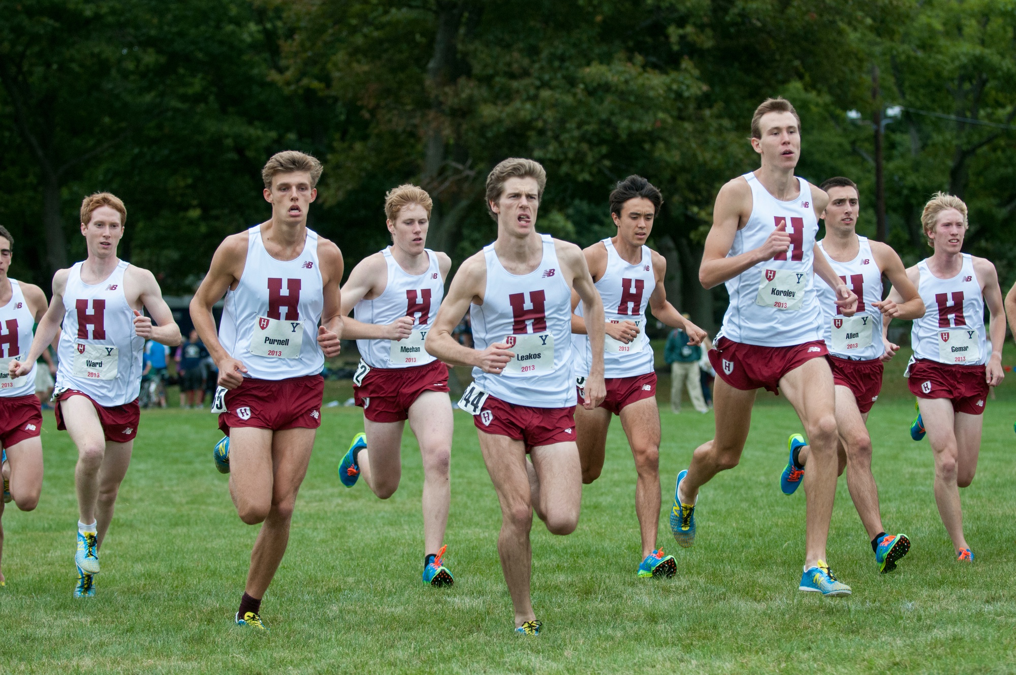 With seniors James Leakos (second from left) and Maksim Korolev (second from right) leading the way, the Harvard men’s cross country team swept the top five spots for a perfect score of 15 against Yale on Saturday.