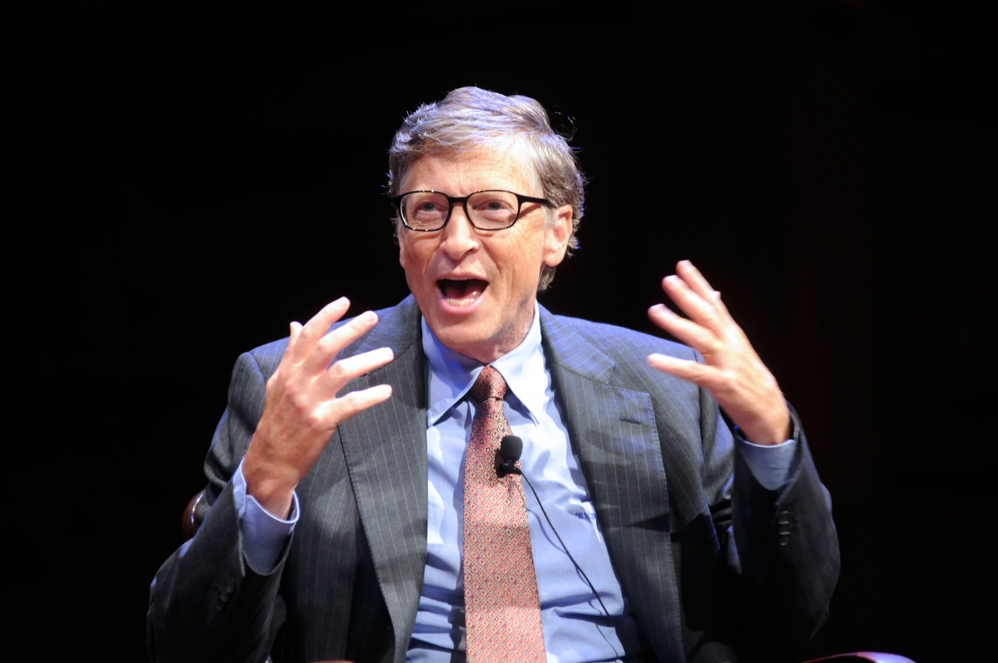 Bill Gates jokes about his reputation for not attending classes in his Harvard years with financier David M. Rubenstein during the public launch of The Harvard Campaign on Saturday. The two met for a discussion about philanthropy in Sanders Theatre as part of the weekend's launch events.