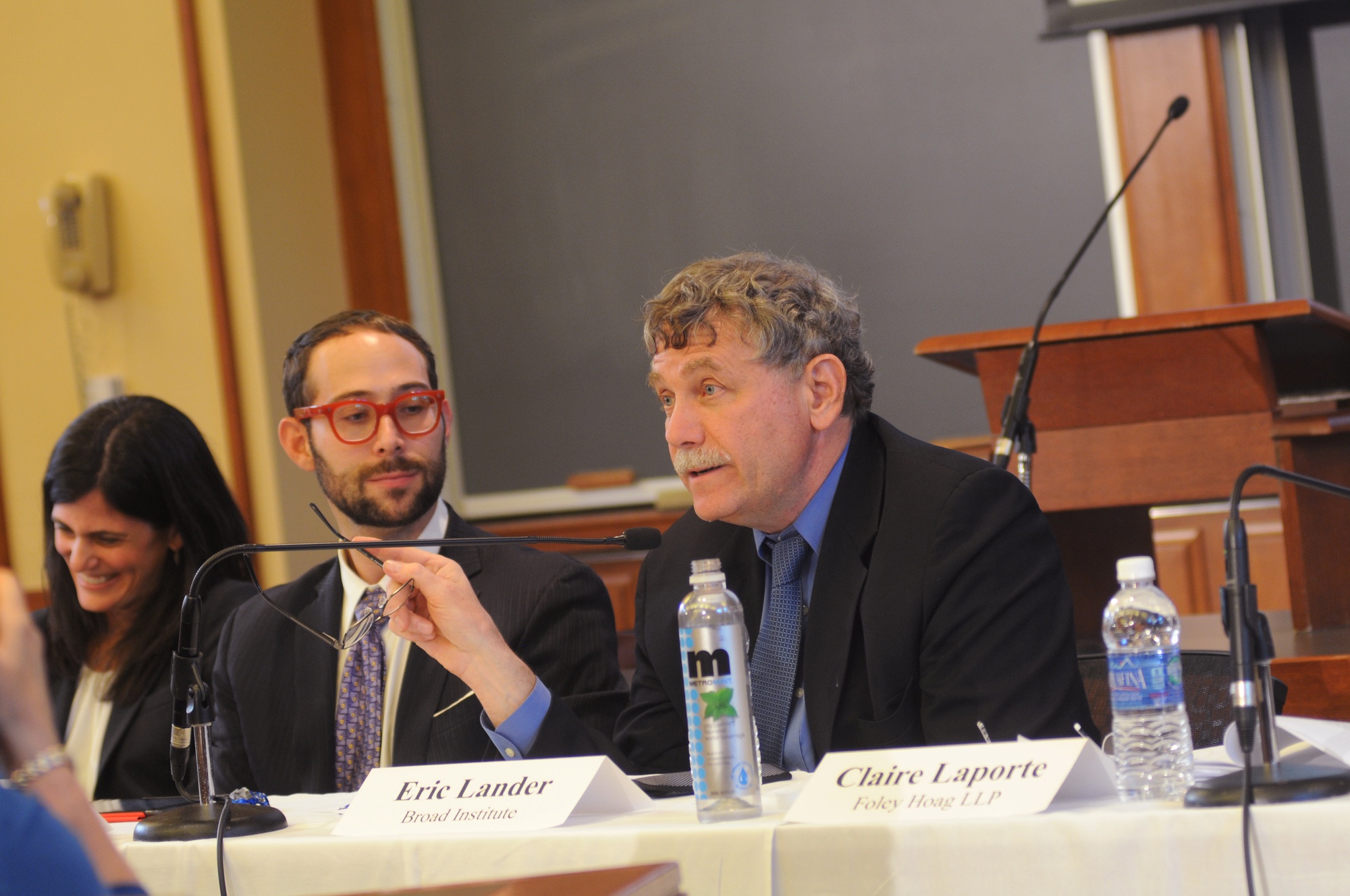 MIT biology professor Eric Lander voices his opposition to gene patenting at a panel discussion at Harvard Law School on Monday as HLS professor I. Glenn Cohen looks on. The panel focused on the 2013 Supreme Court case Association for Molecular Pathology et al v. Myriad Genetics.