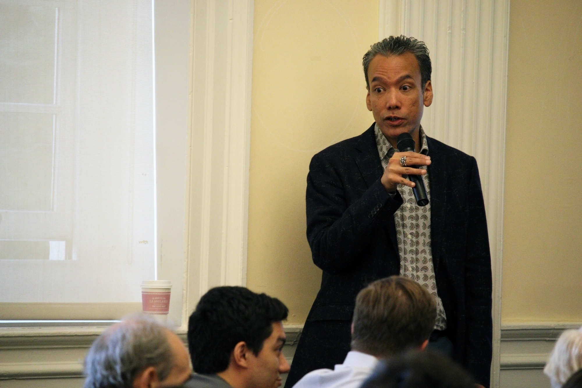 Professor Robert Lue prompts the audience for questions about HarvardX during a town hall meeting Thursday evening in Harvard Hall. Lue and fellow faculty members discussed courses, research, and objectives of HarvardX going forward.