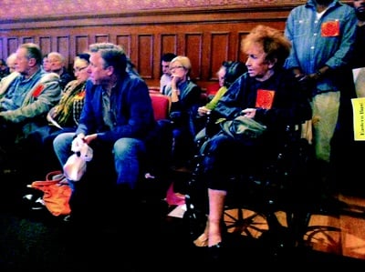 Cover image for Residents Try To Smoke Out Public Housing Smoking Ban at City Council Meeting