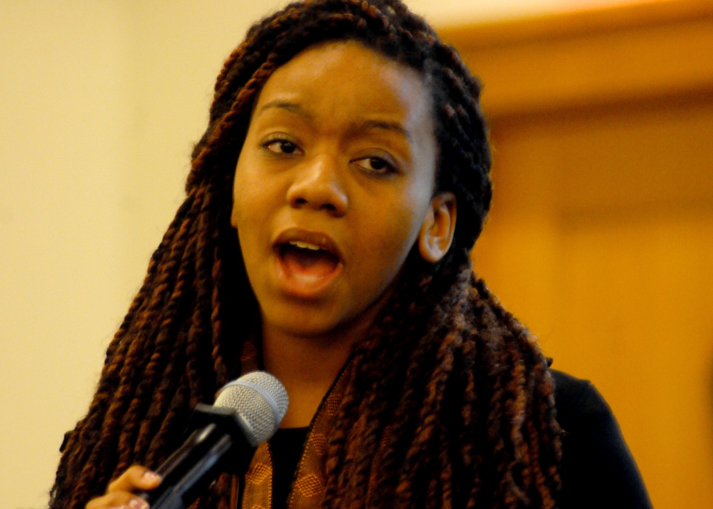 Paige Woods, '16 sings a solo with the Kuumba Singers of Harvard College at the Nigerian Independence Day Gala. The performance was one of several that occurred that night, including traditional dance and spoken word.
