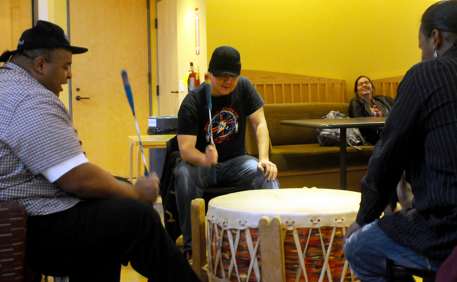 Boston-based native drum group Urban Thunder performs ceremonial songs at the Indigenous People's Day celebration. The inter-tribal group was just one of the night's performances which also included spoken word and dances from Ballet Folklorico.