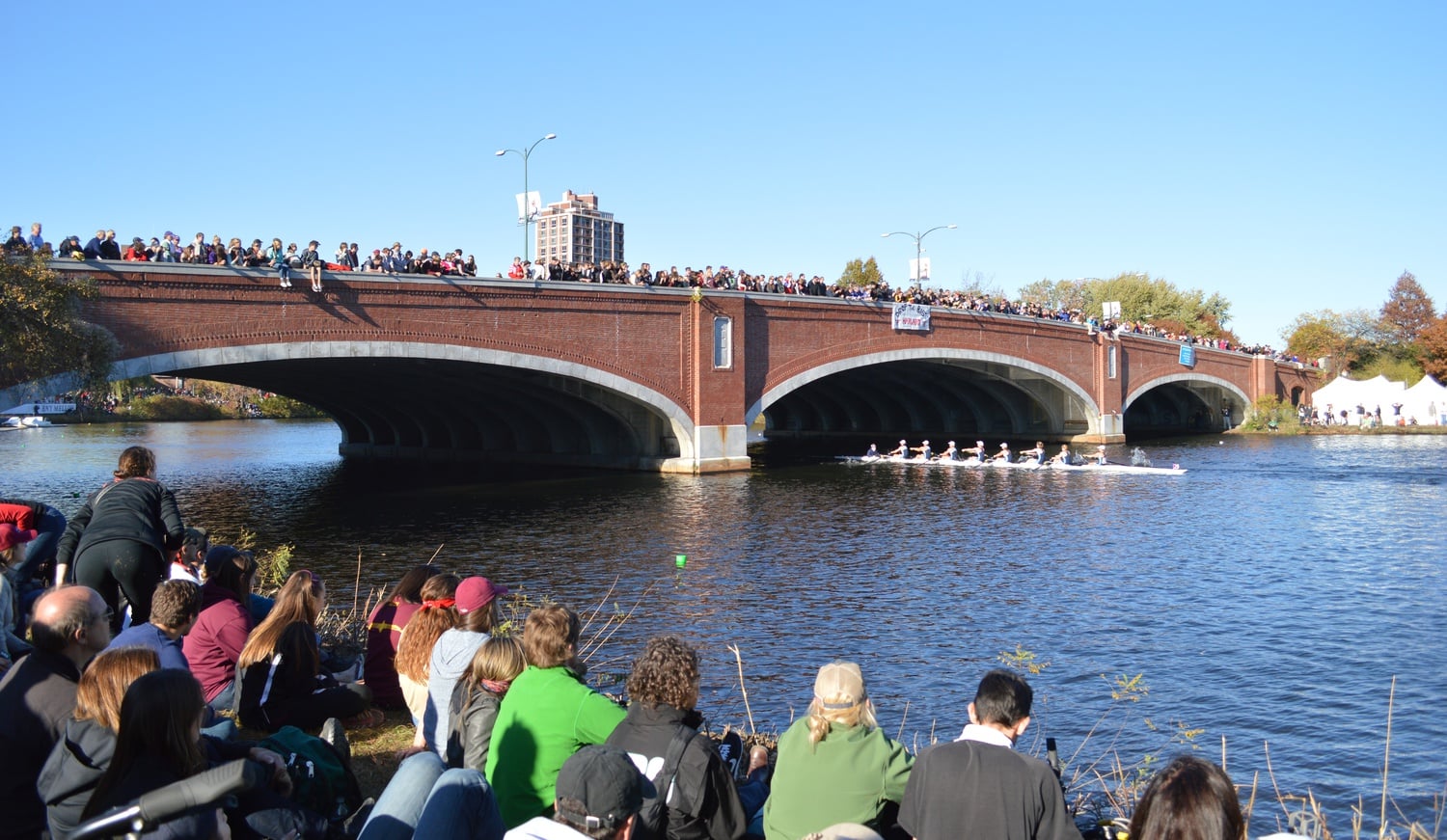 Crowds cheer and watch up and around the Eliot Bridge on Sunday afternoon. The Sunday races were the last scheduled for this year's HOTC event.