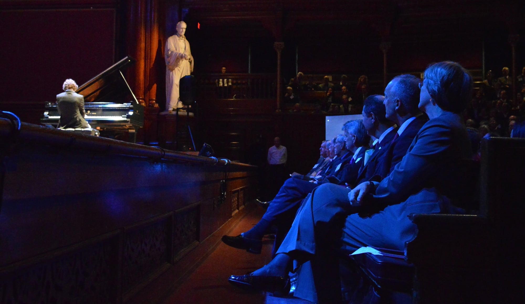 Administrators watch Chase E. Morrin ’15 give a piano performance at the FAS campaign launch in Sanders Theatre on Saturday morning. 