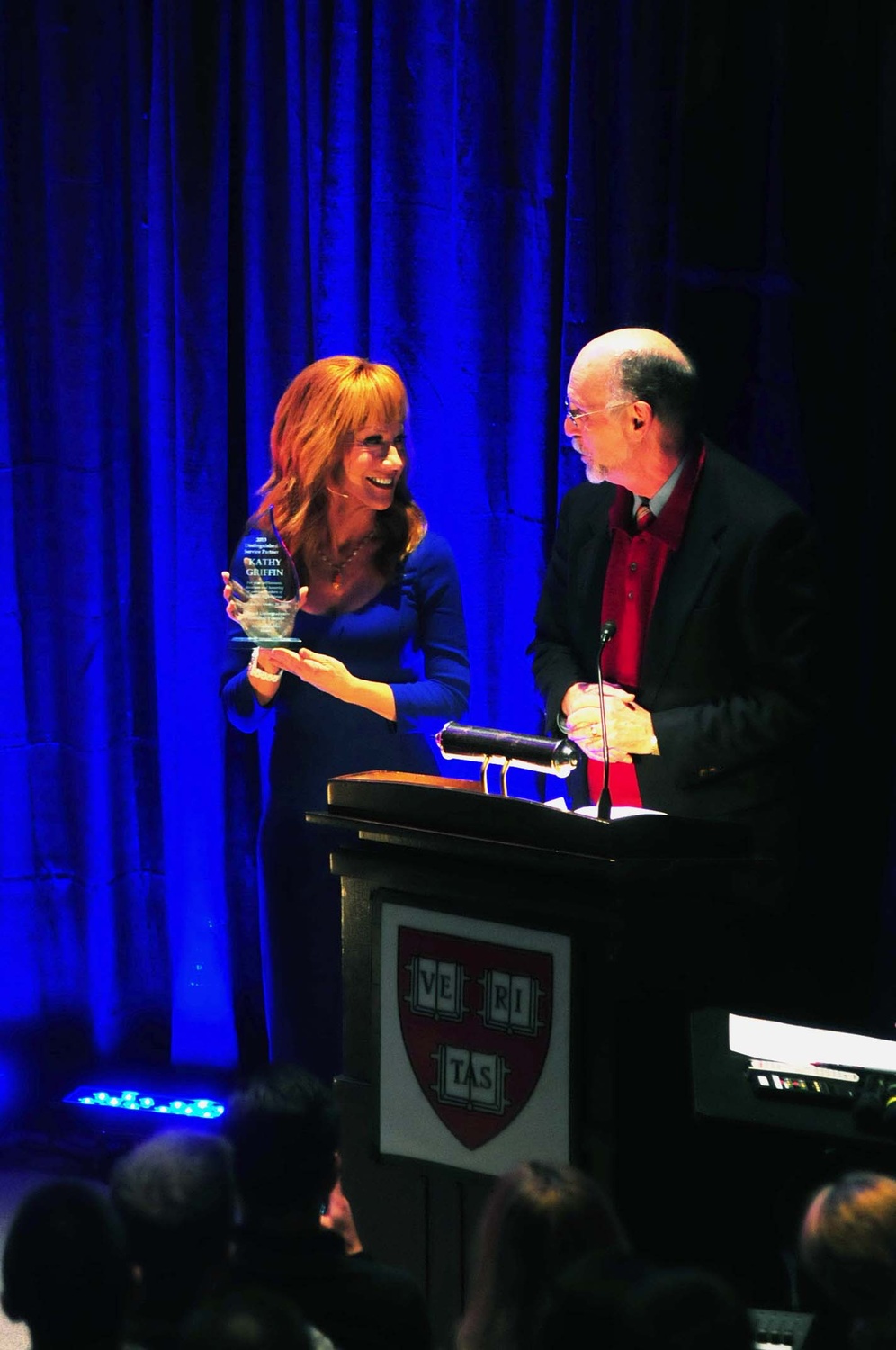 Interim Dean of Harvard College Donald H. Pfister presents comedian and veteran advocate Kathy Griffin with the 2013 Distinguished Service Partner award at "Standing Tall for Veterans," a comedy charity benefit for the Home Base Program presented by the Harvard Undergraduates Honoring Veterans on Saturday afternoon. 