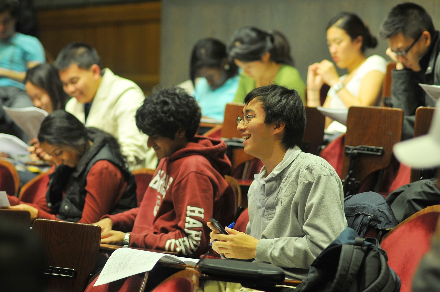 Currier Representative Sietse K. Goffard '15 asks a question about Undergraduate Council Large Venue Grants at the UC general meeting on Sunday night. Representatives were joined by Dean of Student Life Stephen Lassonde and representatives from the student government at Boston University.