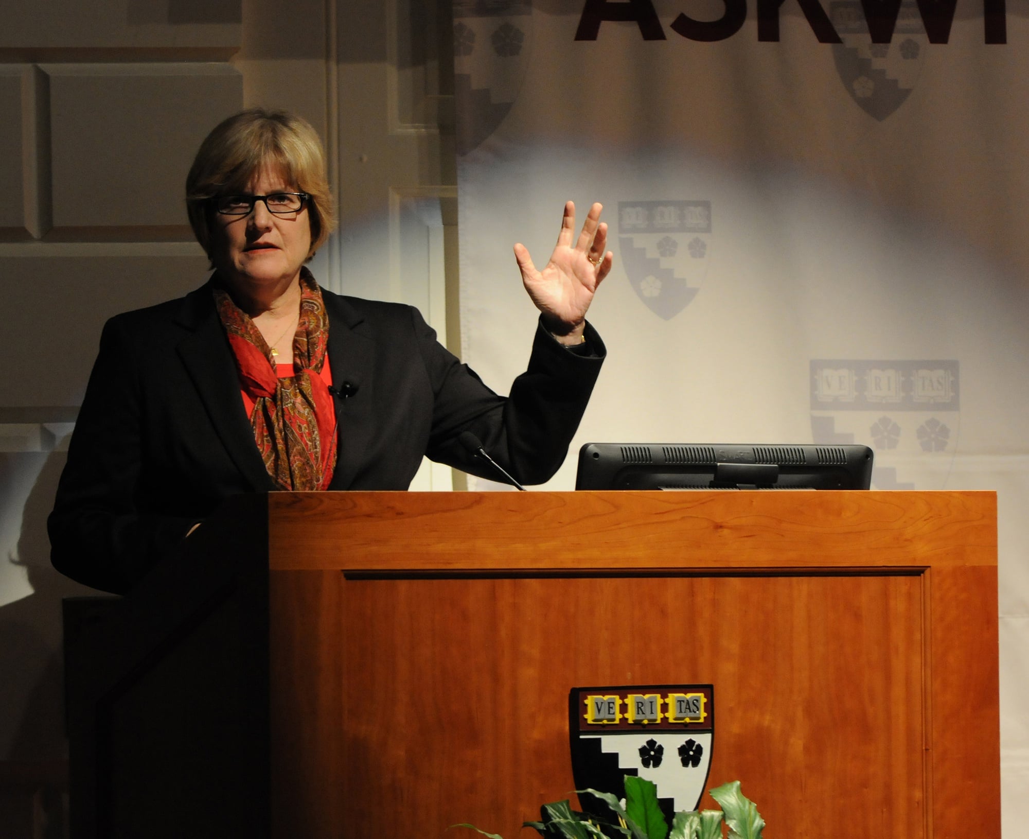 Clayton Spencer, current president of Bates College, speaks to the crowd in the Askwith Forums on Thursday night. Spencer was previously Harvard's Vice President for Policy and the founder of the Crimson Summer Academy. 