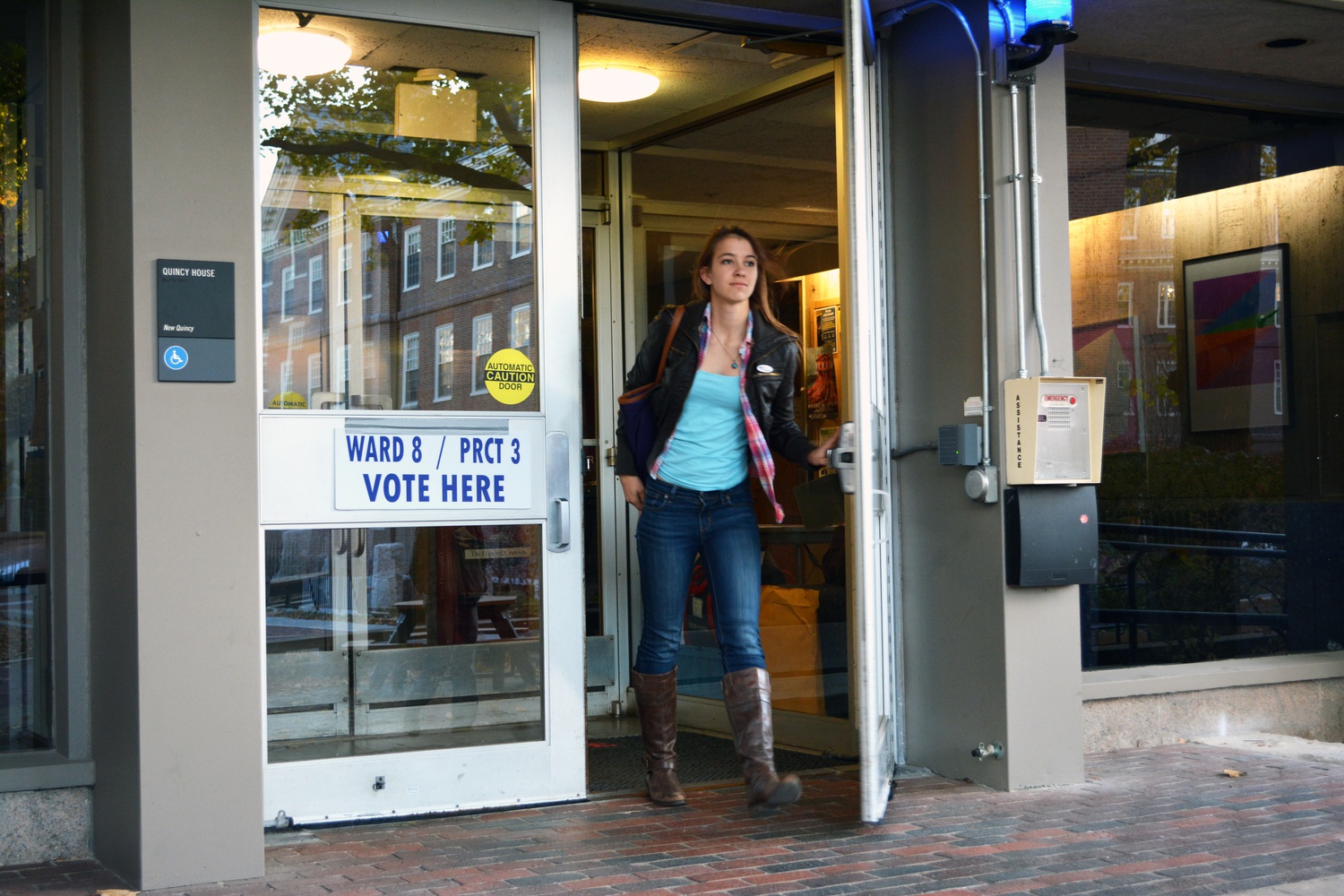 Justyna Pietrus '16, a resident of Mather, leaves Quincy House after exercising her right to vote. All different members of the Harvard community, from freshman to faculty, participated in the vote on Tuesday November 5th.