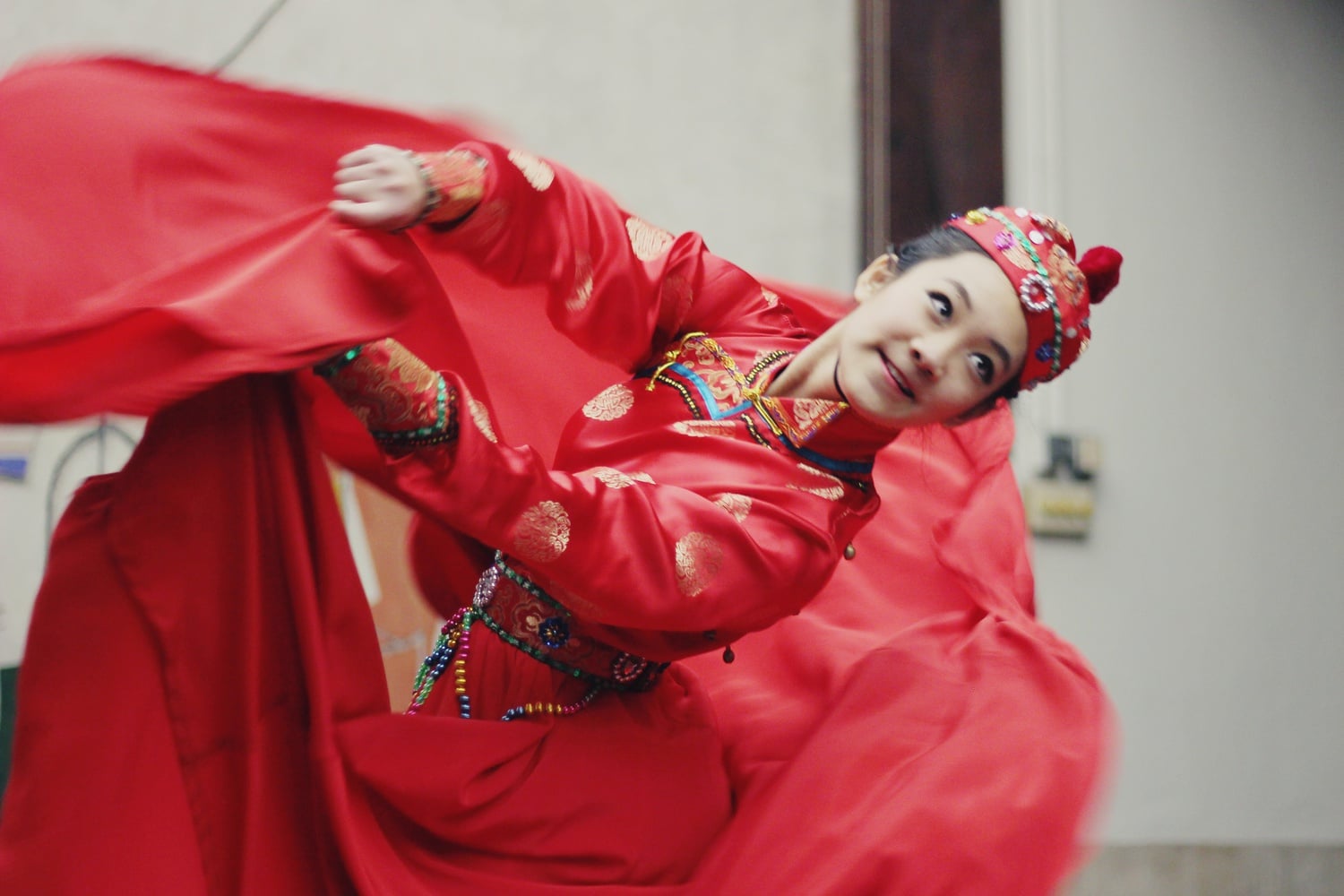 Elaine Dong '16 performs a cultural dance, "The Mongol" at FEAST hosted by the Asian-American Association in Quincy dining hall on Friday night.  
