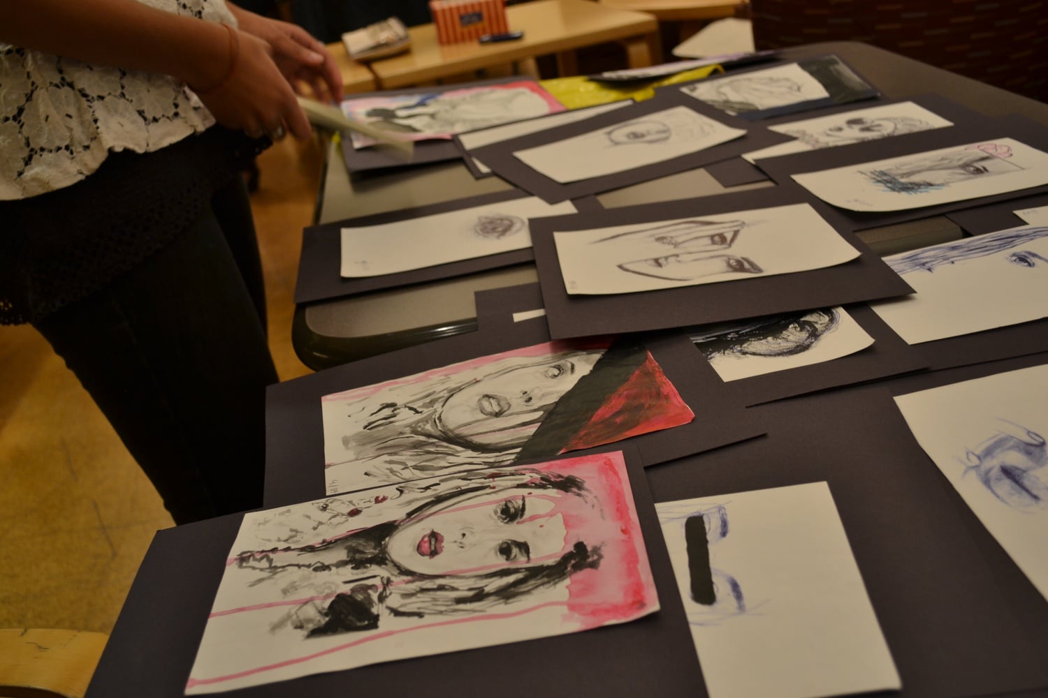 Jenifer A. Brown '15 prepares her paintings for display at the first annual BlackC.A.S.T. Spotlight event on Friday.
