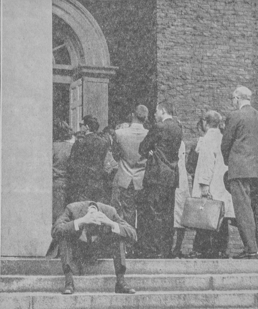A student weeps as mourners gather outside Memorial Church on Saturday, November 23, 1963, to remember the fallen President. The photograph ran as the top image on the front page of the Monday, November 25, 1963, issue of The Crimson. 