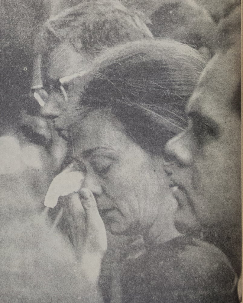 One mourner among a reported 2000 who gathered in Memorial Church on Saturday, Nov. 23, 1963, to demonstrate what the photo's caption characterizes as "the intense sorrow of a stunned nation." The photo ran on page two of the Monday, November 25, 1963, issue of The Crimson.