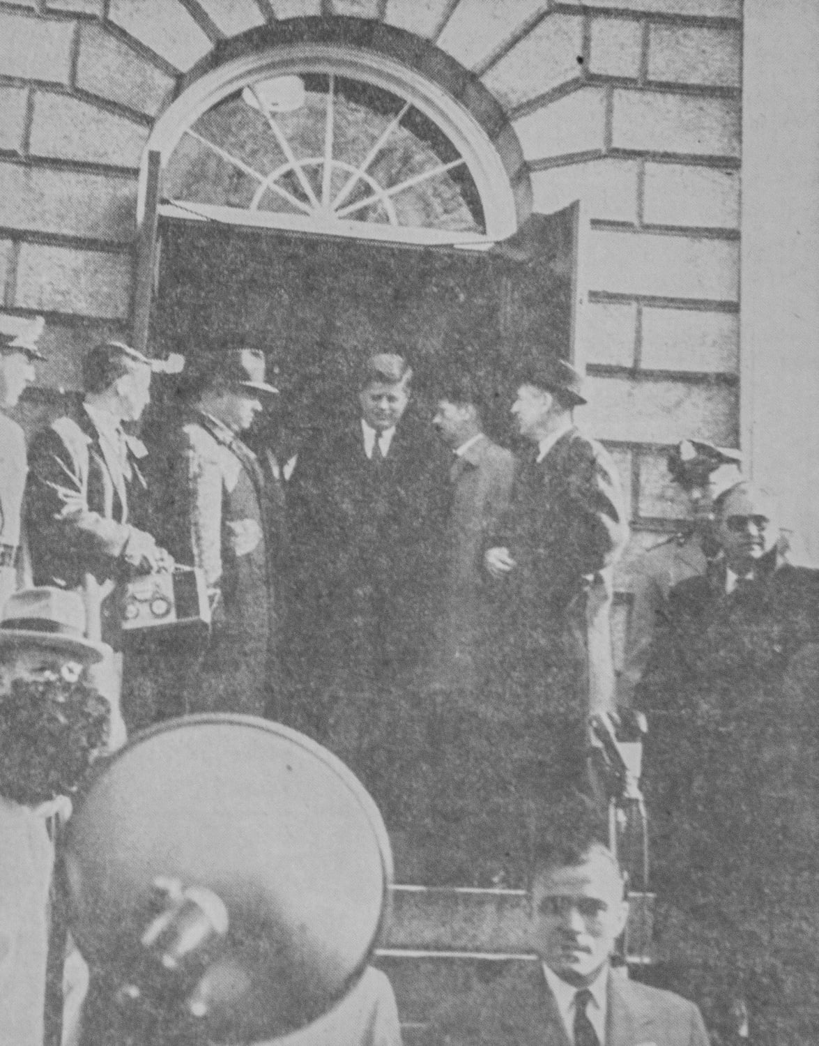 The President-elect leaves University Hall after his final meeting on the University Board of Overseers on January 9, 1961. The photograph ran on page four of the Tuesday, November 26, 1963, issue of The Crimson.