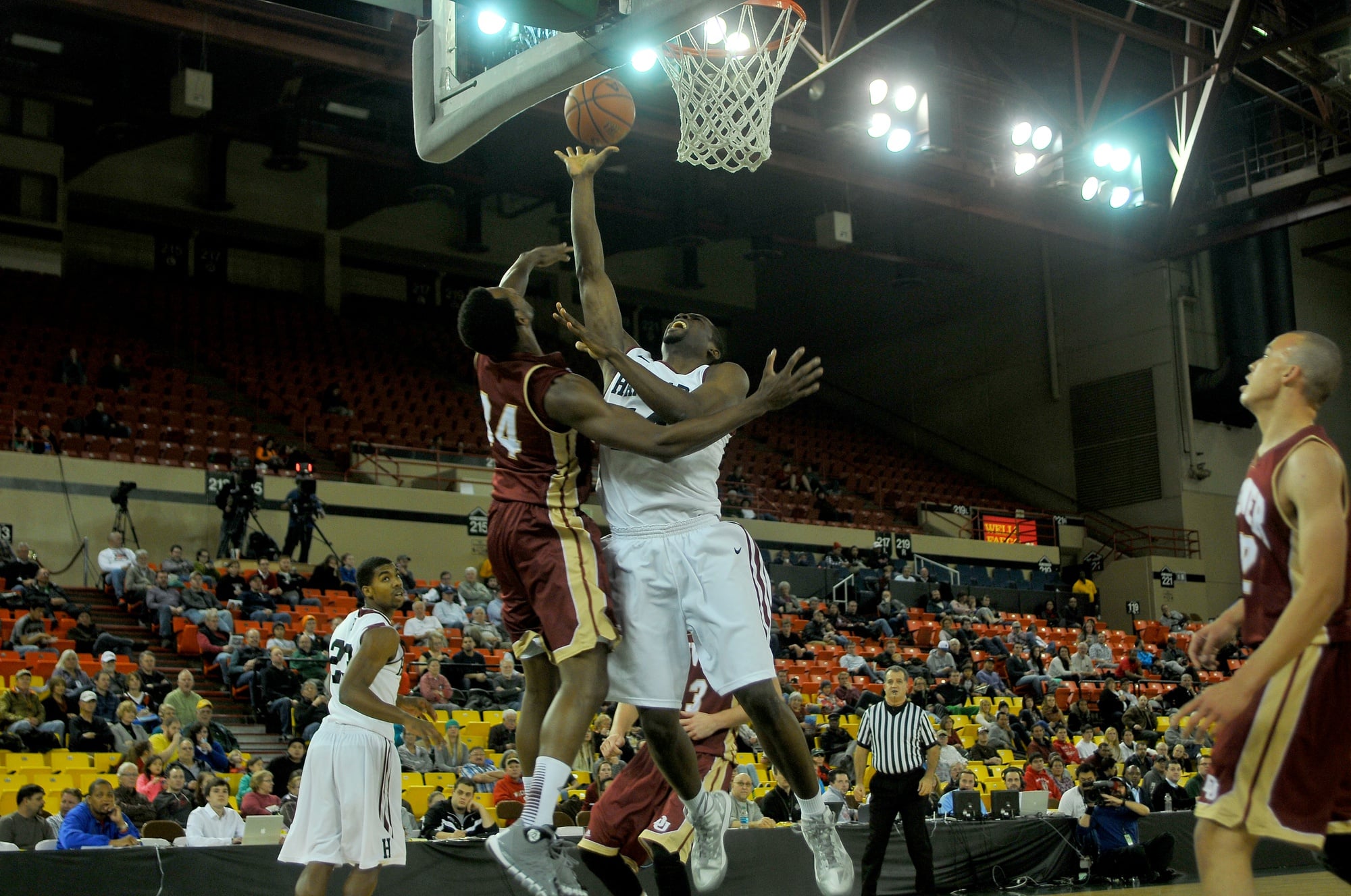 Junior forward Steve Moundou-Missi puts in two of his 20 points in Thursday night's win over Denver. The victory moved Harvard into the semifinals of the Great Alaska Shootout in Anchorage, Alaska, the first Ivy team to accomplish that feat in the 36-year history of the tournament.