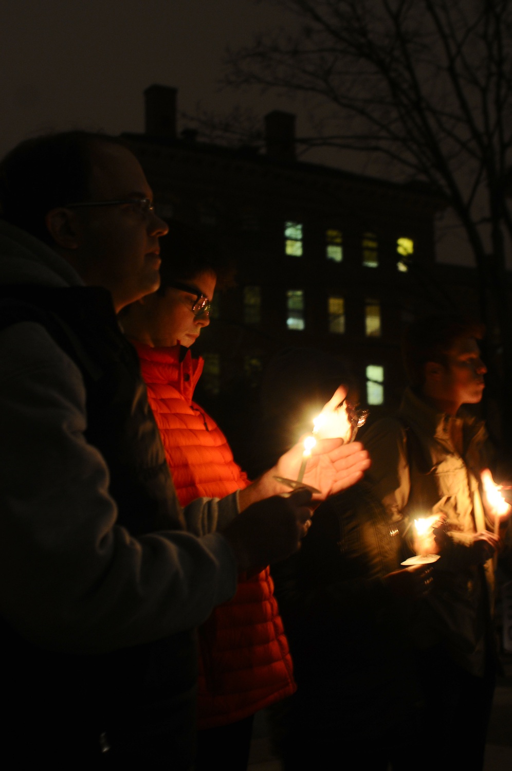 Members of the Harvard community gather outside Memorial Church at a candlelight vigil to commemorate the lives of AIDS victims for World AIDS Day, which was on December 1st. The vigil was sponsored by Harvard Global Health and AIDS Coalition.