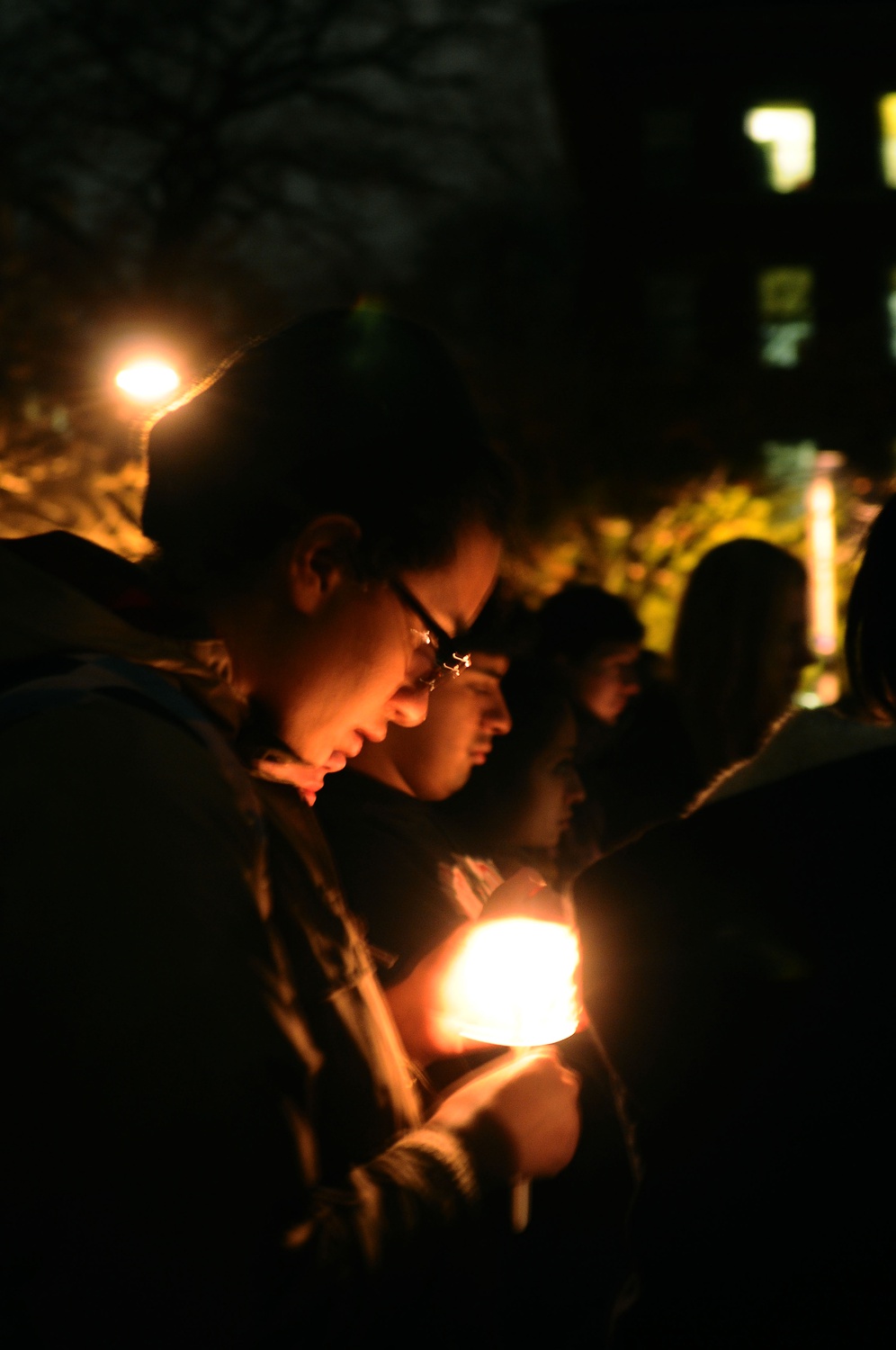Brianna J. Suslovic '16 participates in a candlelight vigil outside Memorial Church to commemorate the lives of AIDS victims on World AIDS Day, which was on December 1st. The vigil was sponsored by Harvard Global Health and AIDS Coalition.