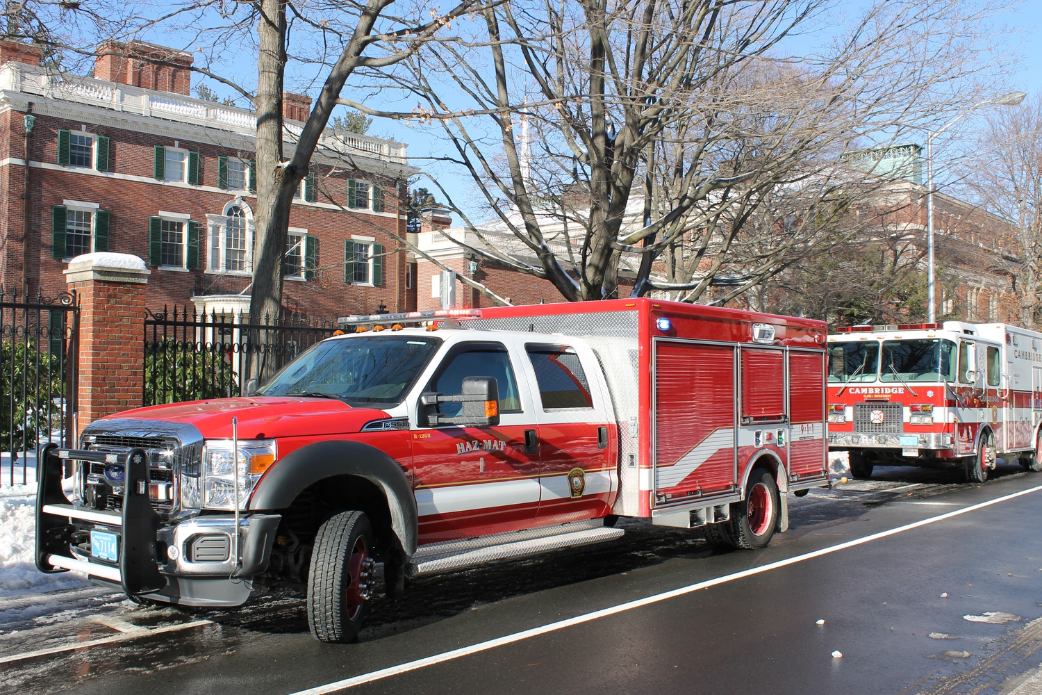 A hazardous materials vehicle from the Cambridge Fire Dept. sits in front of Loeb House on Quincy St. outside of Harvard Yard, near several of the evacuated buildings.