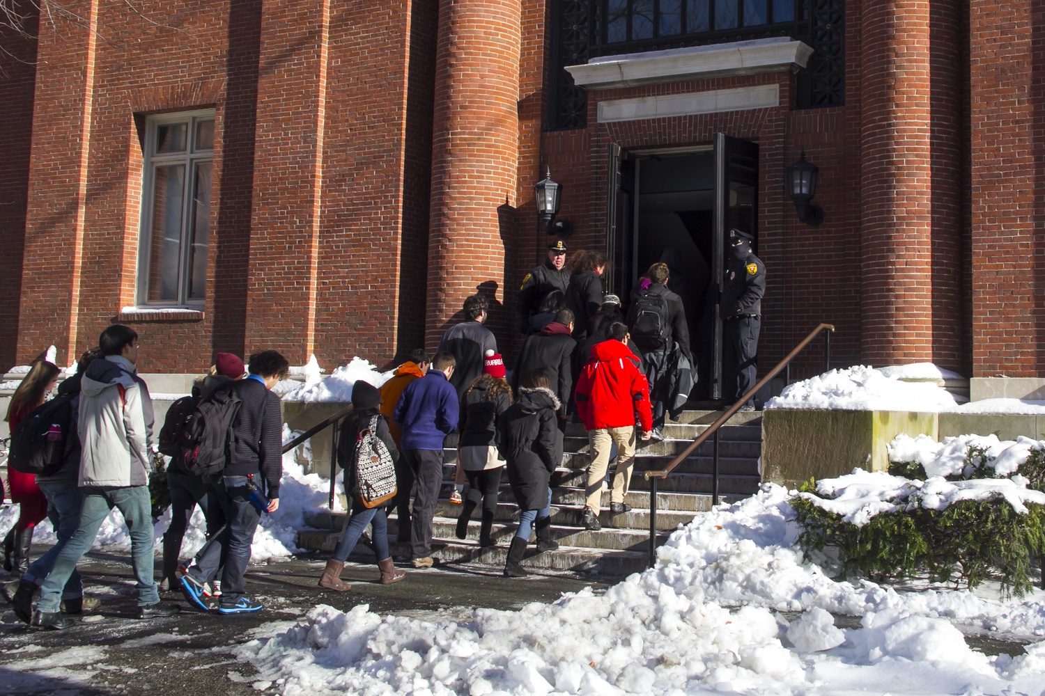 Students enter Emerson Hall to take their final examinations after it had been deemed safe by University officials.