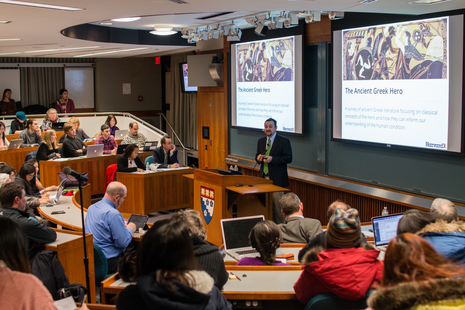 Justin Reich, HarvardX Research Fellow, briefly describes the HeroesX curriculum as an introduction to the findings discovered by analyzing the behavior of registered users of HarvardX courses. The HarvardX Research Presentation occurred on January 21 at Larsen Hall.