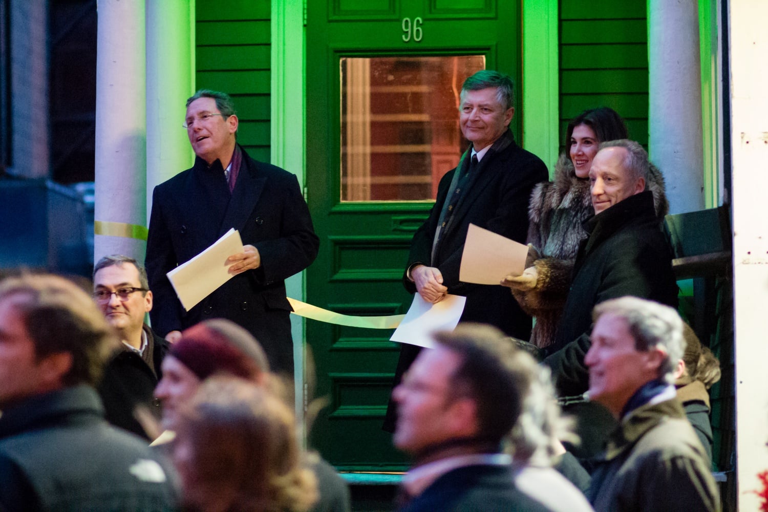 "Grand Sphinx" Andrew L. Farkas ’82, far left, speaks at the dedication of the new Hasty Pudding Institute of 1770 clubhouse to a crowd that included Dean of the Faculty of Arts and Science Michael D. Smith, far right.