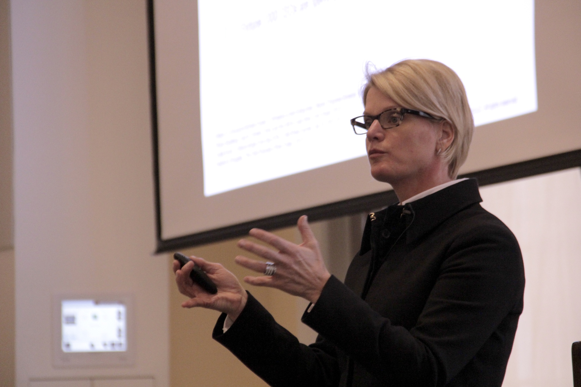 Consultant and LGBTQ advocate Christie Smith discusses "covering," a behavior she says is characteristic of minorities on Sunday afternoon at Harvard Business School. This talk was part of the annual LGBTQ Conference at Harvard University that took place over the weekend.