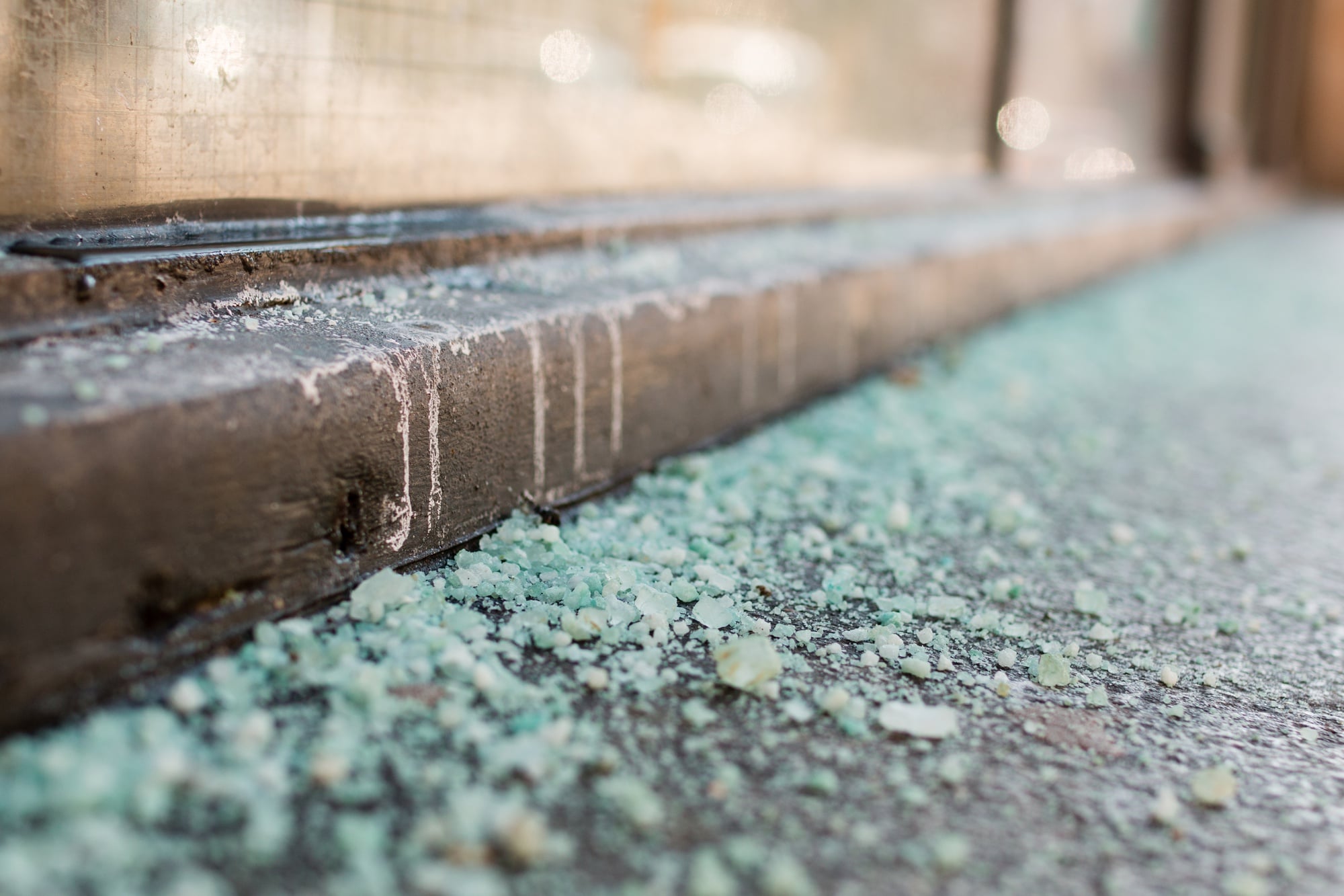 Salt lies on the sidewalk of Plympton Street as the snow-cleanup comes to a end.