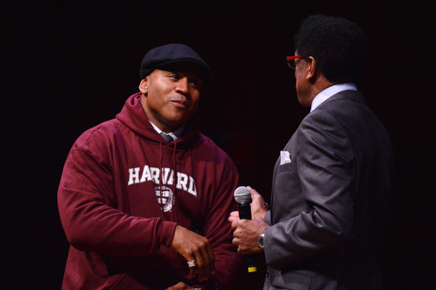 Harvard Foundation Director S. Allen Counter presents the Artist of the Year award to LL Cool J, who remained on stage as various cultural groups from the University performed during Cultural Rhythms.