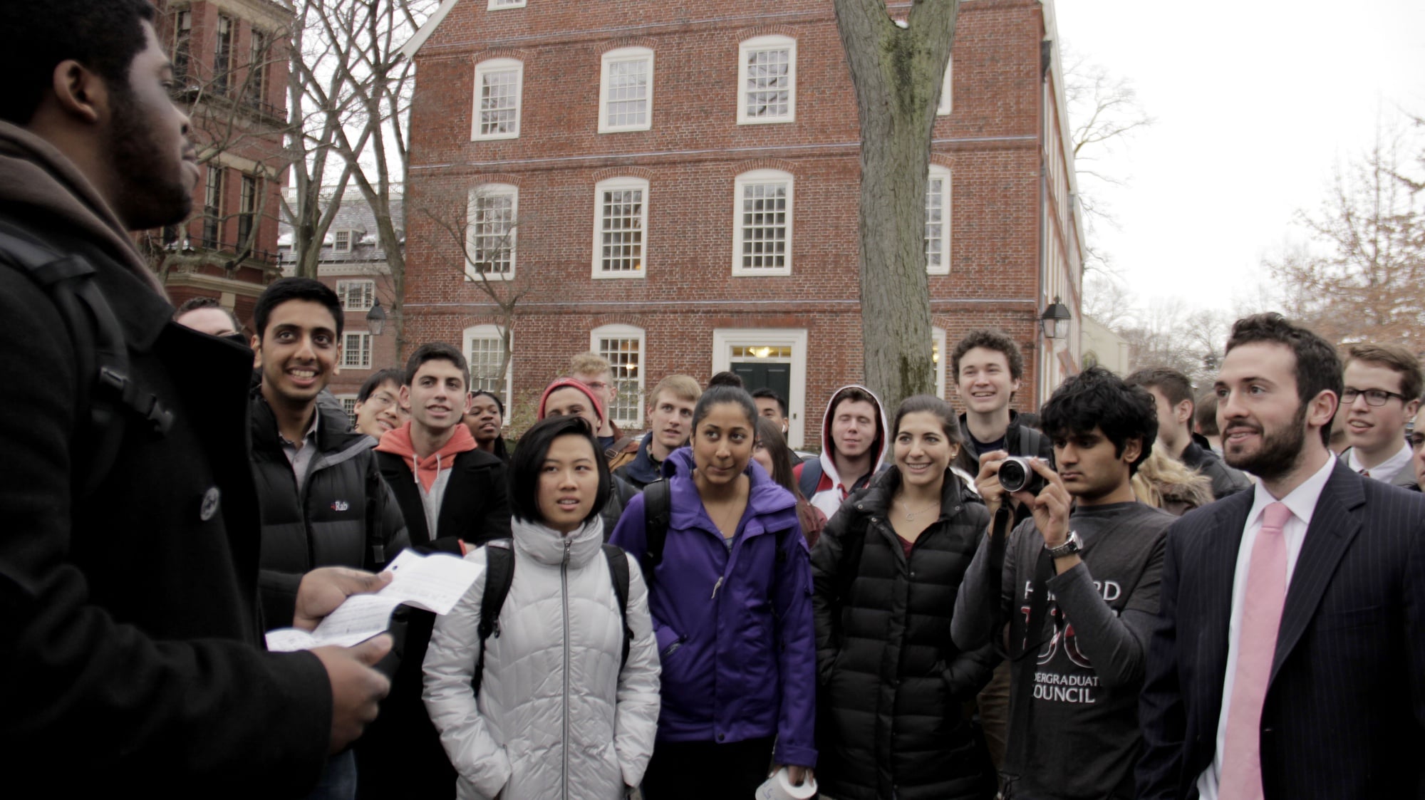 Mayopoulos listens as the president of the Black Men’s Forum, Rodriguez A. Roberts '15, explains how increased student funding would help his club at the Undergraduate Council's 250K Rally. 