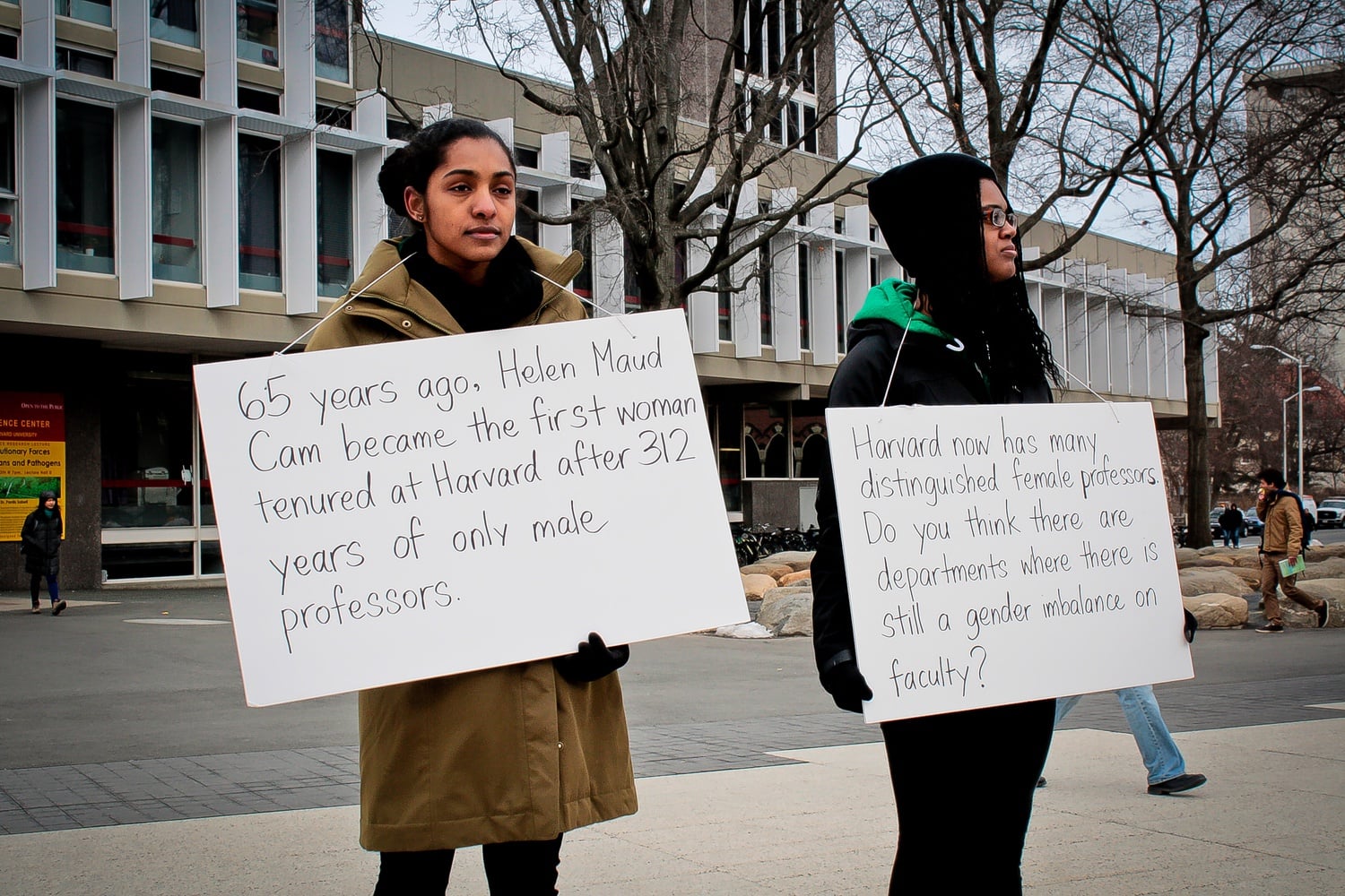 Ceylon Auguste-Nelson ‘16 and Mariah T. Browne ‘15 pose as statues in front of the Science Center on Tuesday afternoon. As part of Women’s Week 2014, the goal was to promote discussion about the role of gender at Harvard.