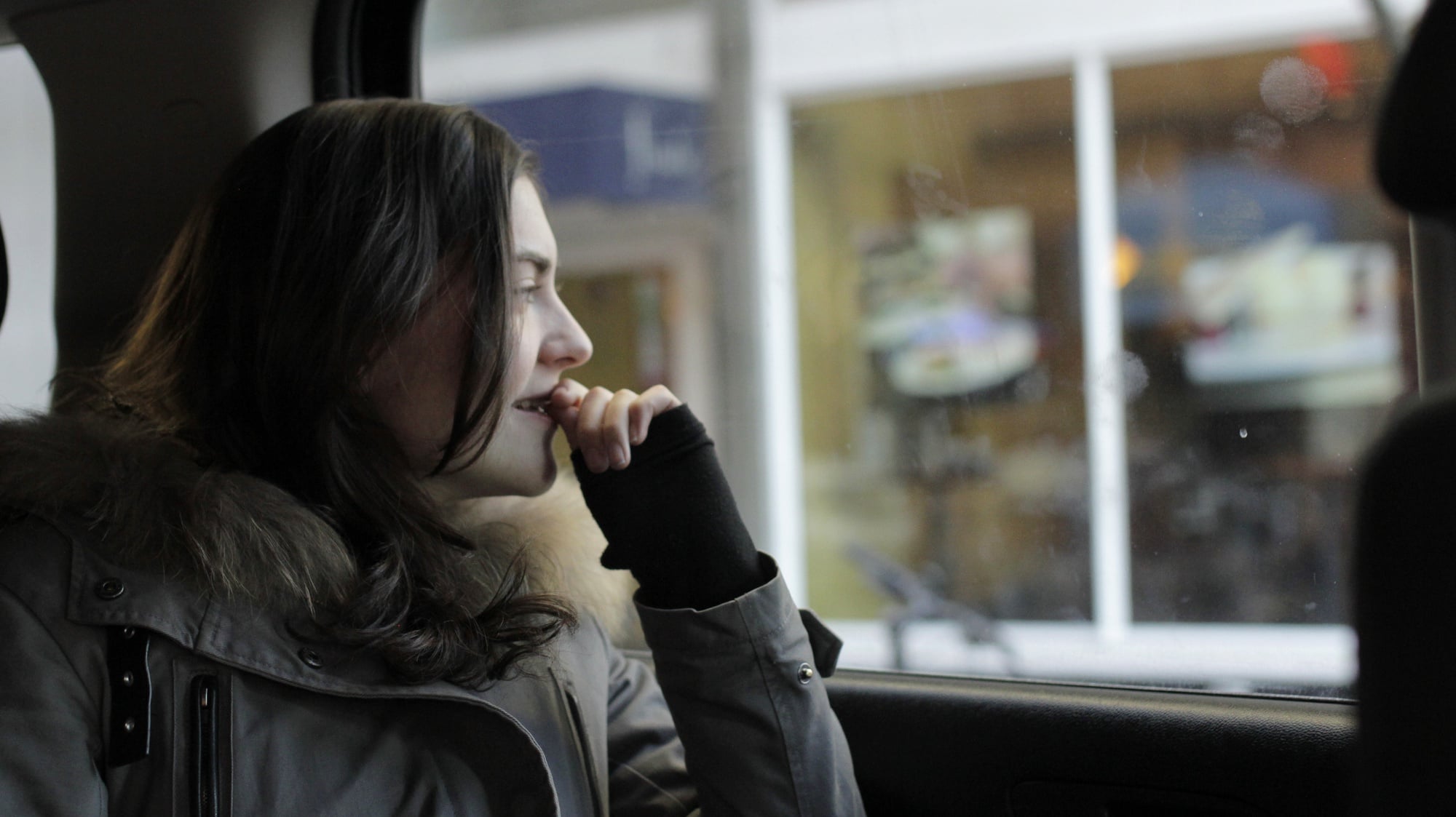 Camille Z. Coppola '14 looks outside of the window while riding in an Uber vehicle. She has Ubered about 50 times.