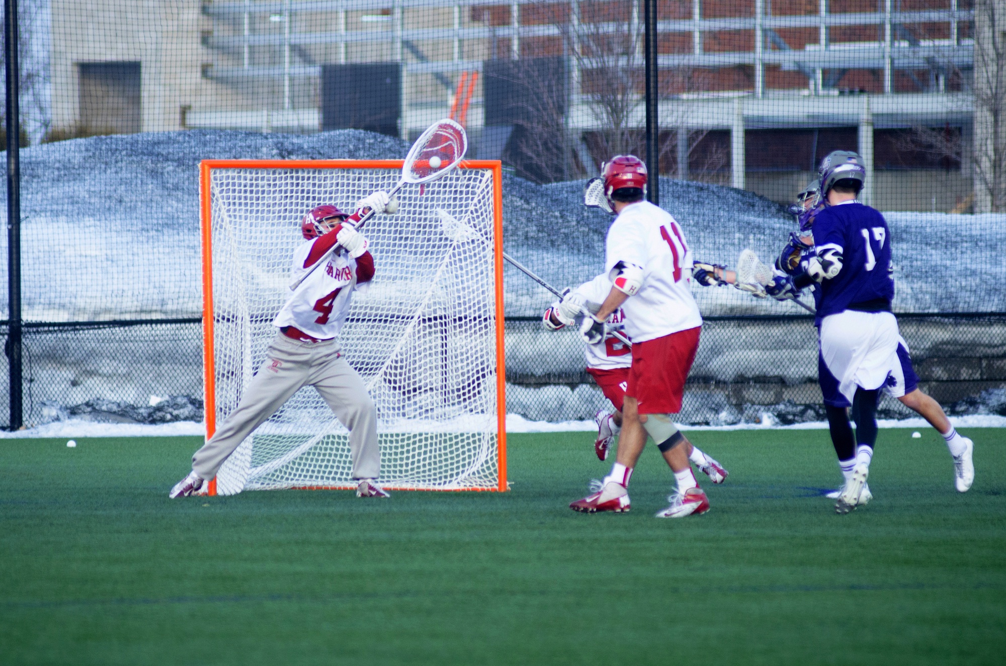 Junior goaltender Jake Gambitsky, shown here in earlier action, held the Bears to just two goals in the second half. The Crimson held on to win its first league game, 16-10.