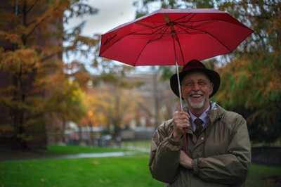 Cover image for Dean Pfister with an umbrella