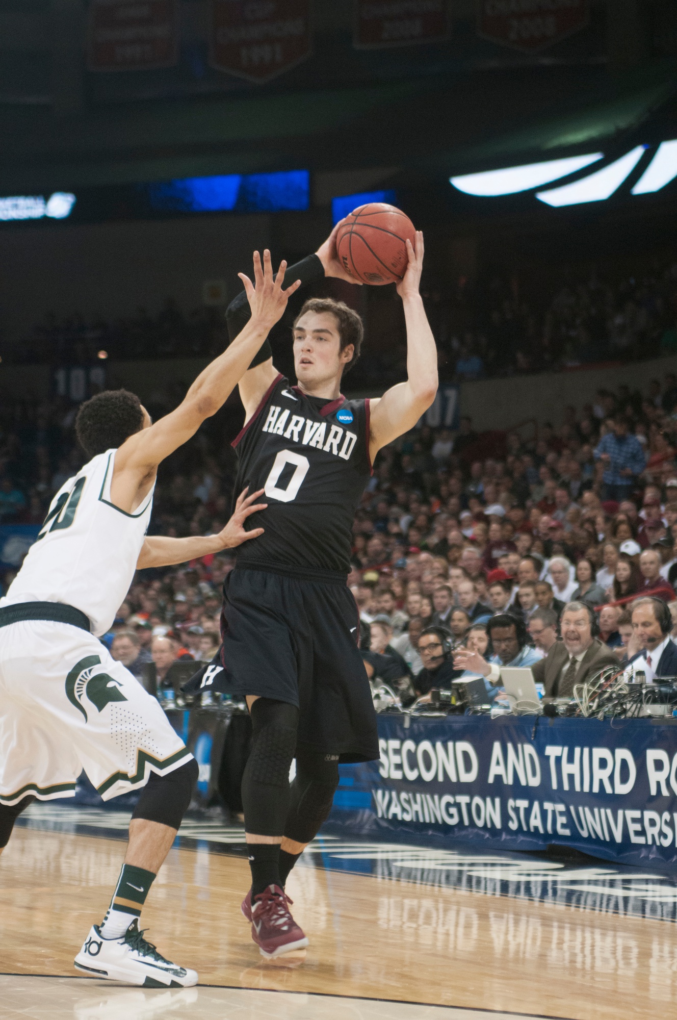 Co-captain Laurent Rivard hit a clutch three-pointer in Harvard’s third-round NCAA matchup to briefly give the Crimson the advantage over Michigan State. Harvard would eventually fall to the Spartans, 80-73. 