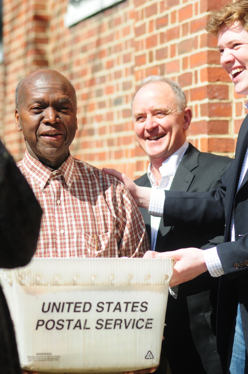 Senior Admissions Officer David L. Evans brings the last box of acceptance letters from the admissions office. 