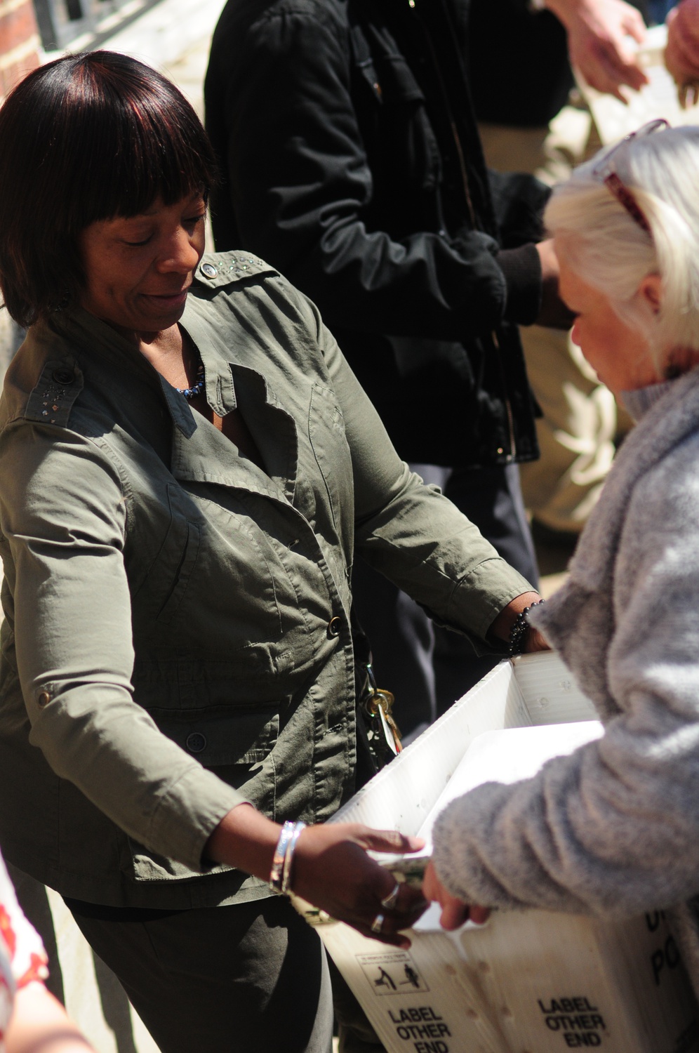 Members of the Admissions Office hand off the boxes of acceptance letters.