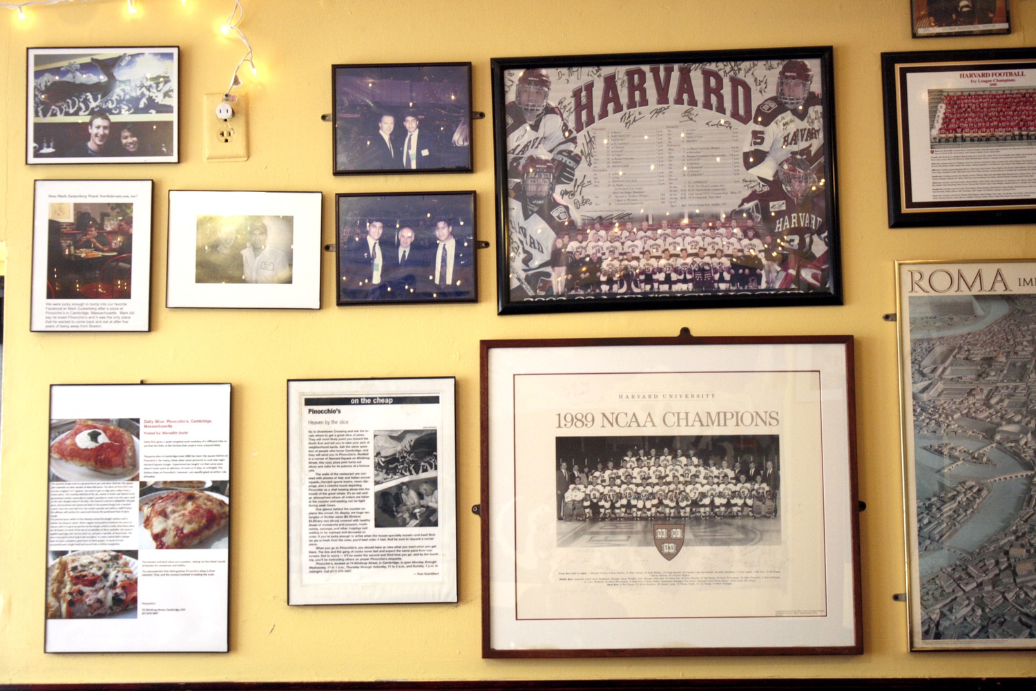 Photos adorn the walls of Pinocchio's Pizza & Subs, relating its rich history in Harvard Square.