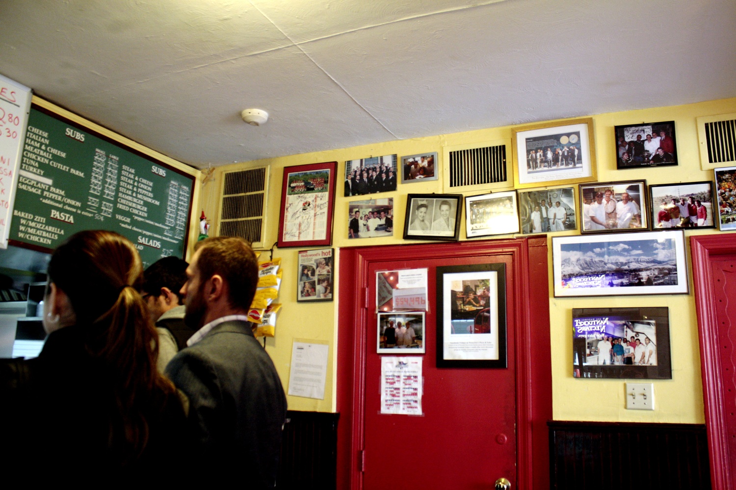 Photos adorn the walls of Pinocchio's Pizza & Subs, relating its rich history in Harvard Square.